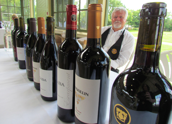 Bill Roberts was among the Rotarians pouring wine for visitors to the All Canadian Wine Championship Passport to Canada fundraiser for the PECM hospital foundation's Life Saver campaign for medical equipment.