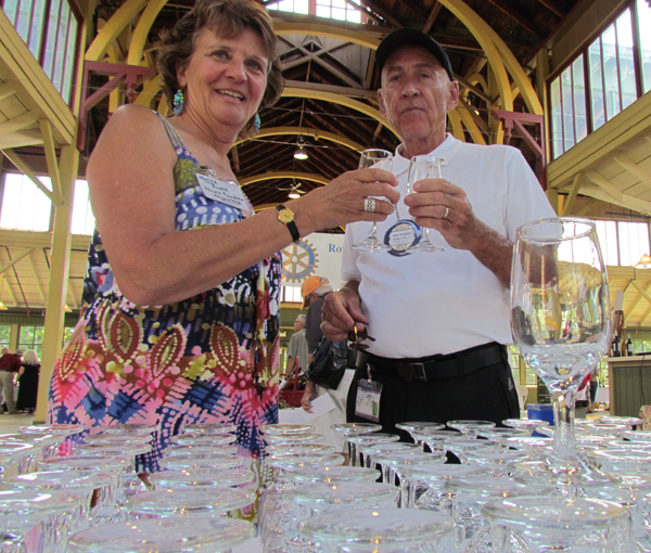 Monica Alyea, of the foundation, and Richard Byers, of Rotary, cheer the partnership of the two groups in support of the hospital.