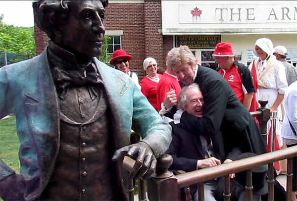 Thomson and Porter (Laurier and Macdonald) ham it up at the sculpture.