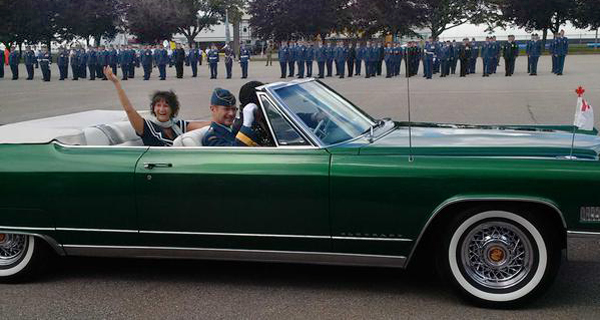 Brigadier-General Lowthian and wife Nancy escorted from 8 Wing Trenton change-of-command ceremony by Elvis. MPP Todd Smith photo