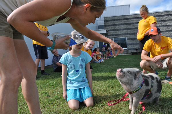 Food for thought - Suzanne Latchford-Kulker keeps Dyson’s attention with food as the children and adults at the RecPlex Kidz Camp gather around. Ross Lees photo