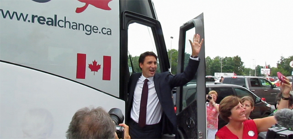 Justin Trudeau pauses to wave and allow one last selfie before he boarded his bus heading to a rally in Peterborough.