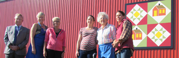 Celebrating the installation of the 100th barn quilt at Hagerman Farms, from left, Robert Quaiff, PEC Mayor, Mary Simpson, of Ontario Barn Quilt Trails; Pat Dubyk, PEC Co-ordinator; and Mary Hagerman with granddaughters JEnnifer and Jody. 