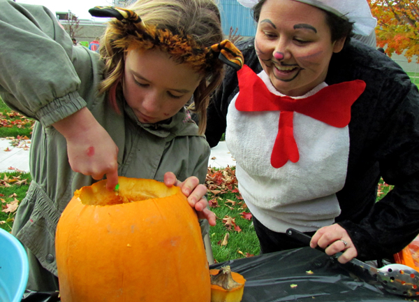 The HUB's Cat in the Hat Sabrina Hudson, with Libby, carving a pumpkin.