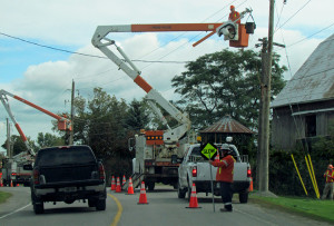 Hydro One workers replacing poles on East Lake Road.