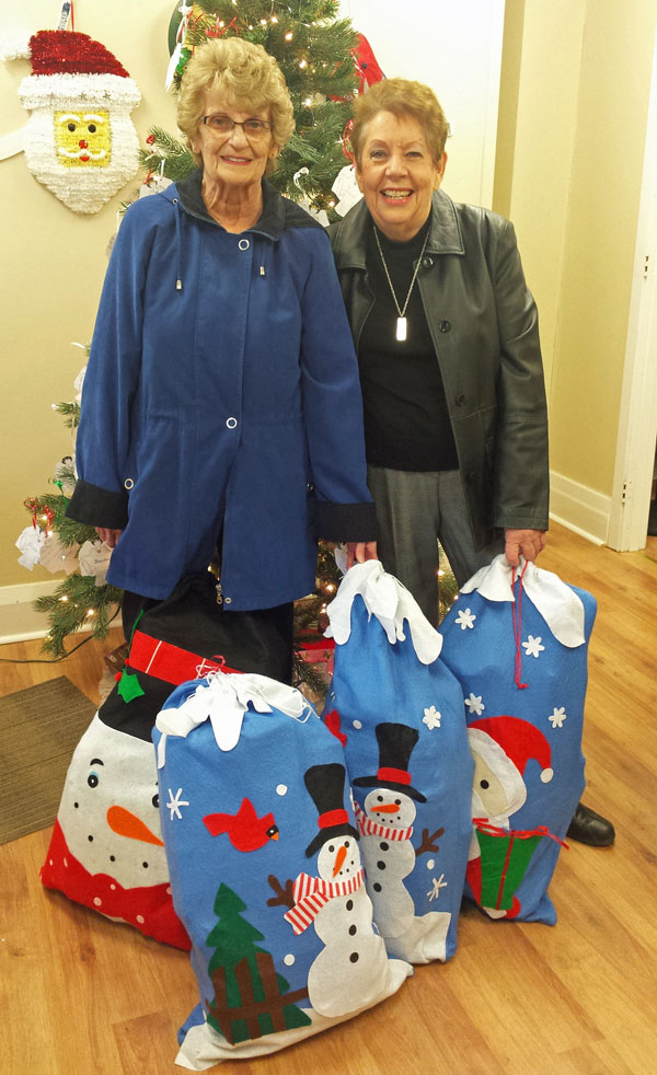 NOV. 18 - Angels from Harmony House drop off donations to help make Christmas brighter for County children.