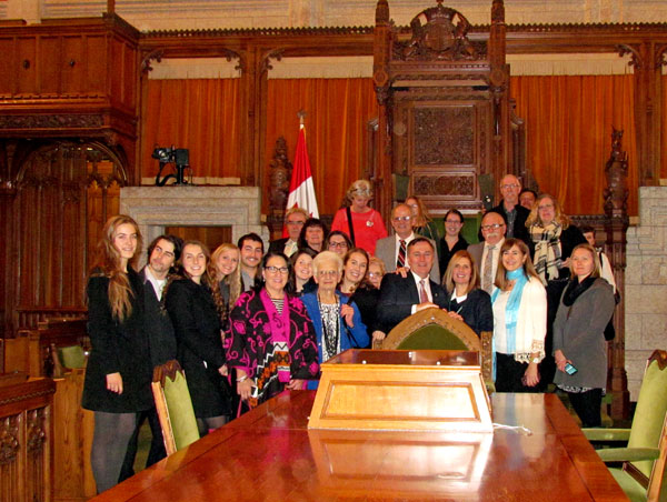 Group photo around the chair of the Speaker of the House.
