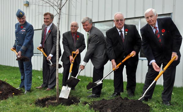 A Highway of Heroes Living Tribute tree is planted outside the Passenger Terminal, 6 North Star Drive, at CFB Trenton on Nov. 6 by Col. Colin Keiver, 8 Wing/CFB Trenton Commander, Neil Ellis, MP for Bay of Quinte, Lou Rinaldi, MPP for Northumberland-Quinte West, Mark Cullen, the chairman of the Highway of Heroes Living Tribute, Jim Harrison, the Mayor of Quinte West, and Eben James Sr of Quinte West. - Ross Lees photo