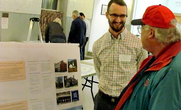 Gary Caley, of West Lake, speaks with County planner James Bar at the Official Plan community open house in Bloomfield Tuesday.