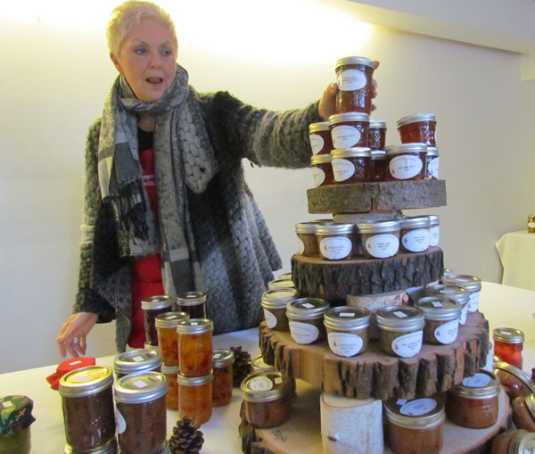 Dorothy Speirs Vincent adds one more jar to the table to preserves being offered downstairs in MacDonald Hall. Baked goods also available until sold out.