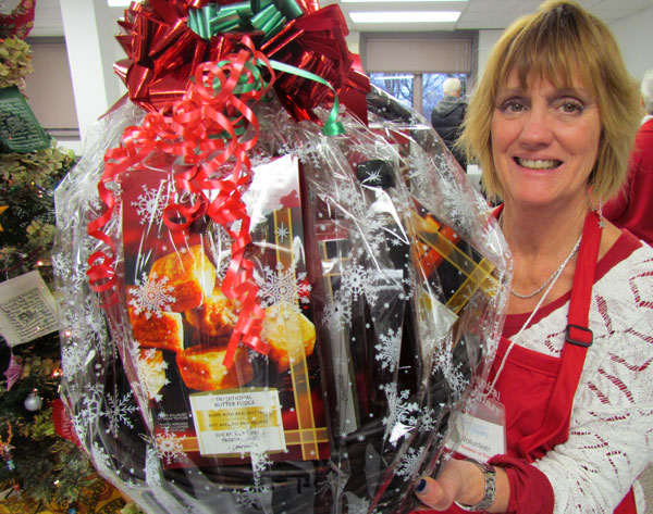Michelle Edmunds with a giant basket filled with yummy treats from Sobeys.