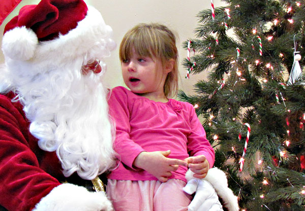 Josie Lewis was a little shy to discuss her Christmas list but was happy to tell Santa about her dogs.