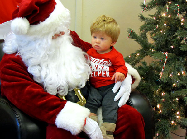 Logan Burns contemplates what he will say when he visits Santa at the Angel Office, at Kin Hall, Benson Park.