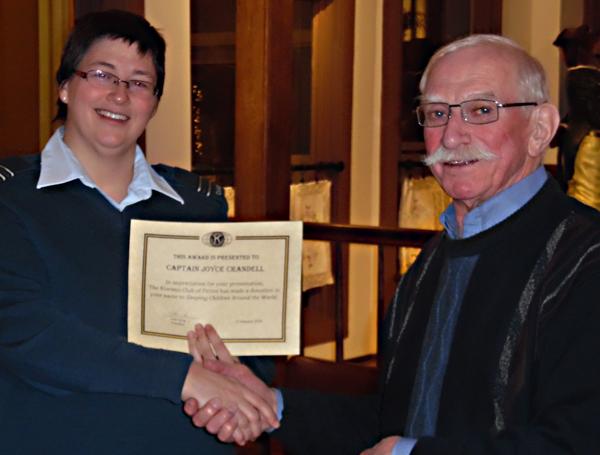 President John Inrig presents a "Sleeping Children of the World" certificate to Capt. Joyce Crandell, Commading Officer of 851 Prince Edward Air Cadet Squadron.