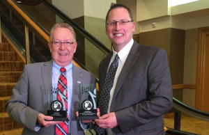 Mayor Robert Quaiff, left, receiving the award from Robert Lamb, President of EDCO.