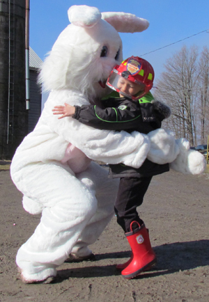 Emerson, of Newmarket, gives the Easter Bunny at big hug. 