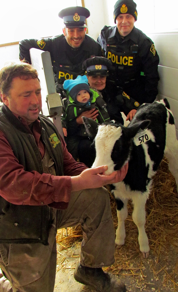 Don Williams showed children and PEC detachment officers visiting the crowds at his farm a new calf - just four days old.