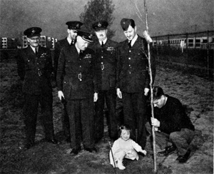 Group Captain Bell-Irving (third from left) watches his grand-daughter, Virginia, help plant the first of 150 English Oak trees, while his Wing leadership look on at 8 Wing/CFB Trenton, 11 April, 1945. Photo: DND Photo Archive