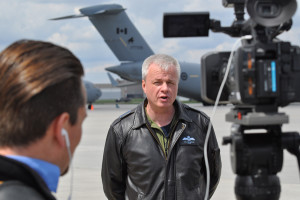 8 Wing Commander Col. Colin Keiver responding to questions from the media concerning the Wing’s tasking to pre-position to assist in Fort McMurray.