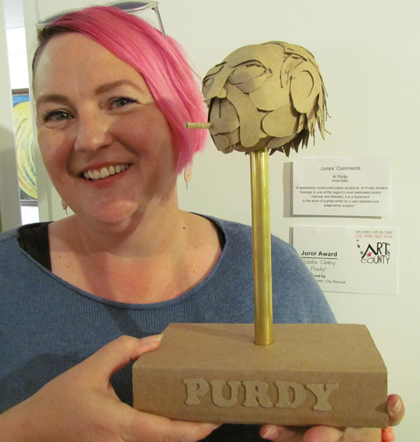 Krista Dalby with her Jurors Award winning "Al Purdy" the jurors called "A remarkable constructed paper sculpture. Delicate and detailed, it is a testament to the work of a great writer by a very talented and imaginative sculptor."