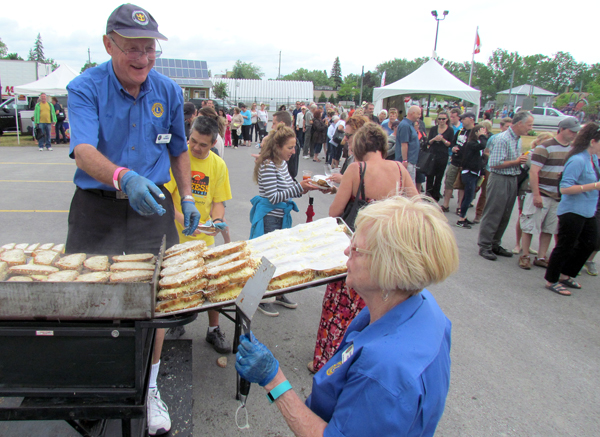 Art Hewer at work preparing 250 grilled cheese sandwiches in the Grilled Cheese Chowdown event.