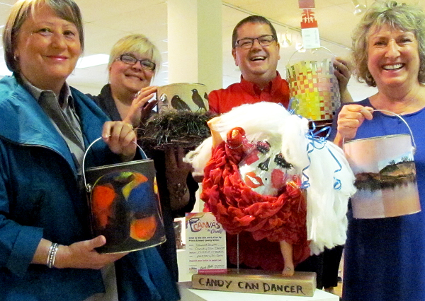 Art in theCounty 2016 co-chairs Annik Despres and Sue Barclay flank Tara Wilkinson, who brought the idea forward, and Adam Busscher, of Home Hardware, sponsor of the campaign. They are holding cans they created - except Adam, who claims his mother Pat got all the family's artistic talent and put together the Home Hardware can.