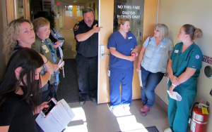 Fire Prevention Officer Mike Branscombe speaking to QHC staff about the importance of the fire alarm system.