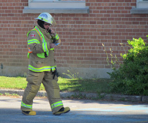 Division 1 Commander Rob Manlow maintaining communication with the firefigthers