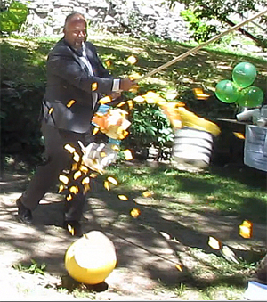 MPP Todd Smith helps PELC to announce our $150,000 Ontario Trillium Foundation Capital Grant by smashing our lightbulb logo pinata!