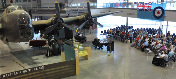 Neil Ellis and staff listen to input from people at Canadian defence policy review Wednesday night at the National Air Force Museum of Canada. Ross Lees photo