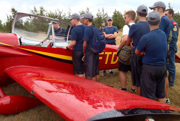 An RV4 plane captures the interest of Air Cadets. The Prince Edward Flying Club member and owner of the RV4 was on site to explain some of the features of this fast, light airplane.