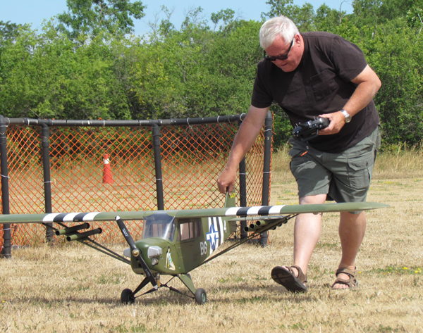 Mike Fielding, president of the club, with his L4 Grasshopper army artillery spotting aircraft.
