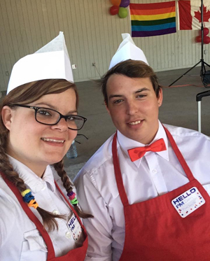 PELC Pops Coordinator, Ashley Watson and PELC student, Domenic Boone served popcorn at the Belleville Pride event.