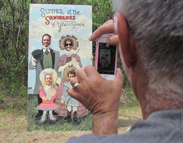 Larry Cuschier, of Angus, photographs family members as a reminder of an old-fashioned day in the sunshine.
