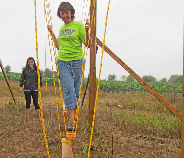 Prince Edward County Memorial Hospital Foundation chair Monica Alyea makes her way through one of the new obstacles.