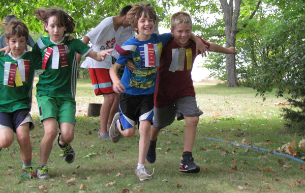 Children earned ribbons in old-fashioned games such as the three-legged race.