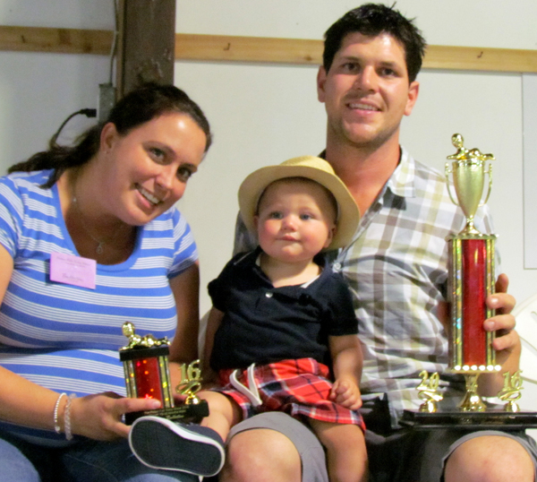 Russell Marek with his "Best Baby" trophies and parents Anna and Michael.
