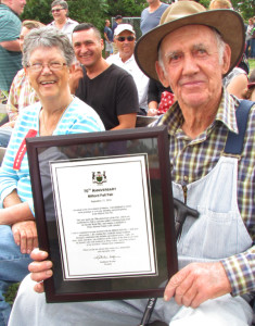 Sandra Emlaw and Wilber Miller with the certificate from Premier Kathleen Wynne  on behalf of all those who were in attendance at Milford's first fair in 1946.