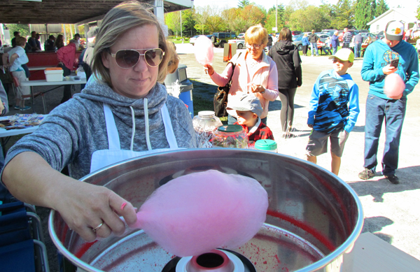 A new fundraiser for the Storehouse Foodbank in Wellington, the cotton candy machine, operated here by volunteer Toni Murphy, perfectly complemented the candy table.