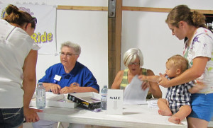 Lana Latchford and Nancy Craig take last-minute registrations.