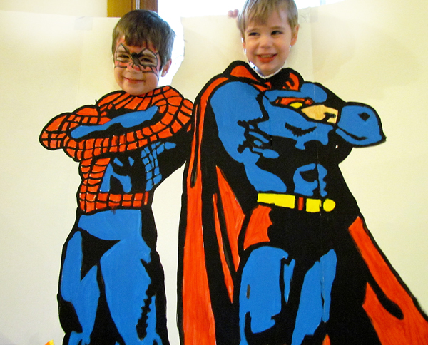 Super heroes Harrison and Nicholas pose for a photo