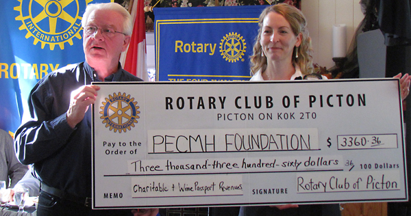 Rotary treasurer Maurice Carlier presents proceeds to Hospital Foundation Executive Director Penny Rolinski.