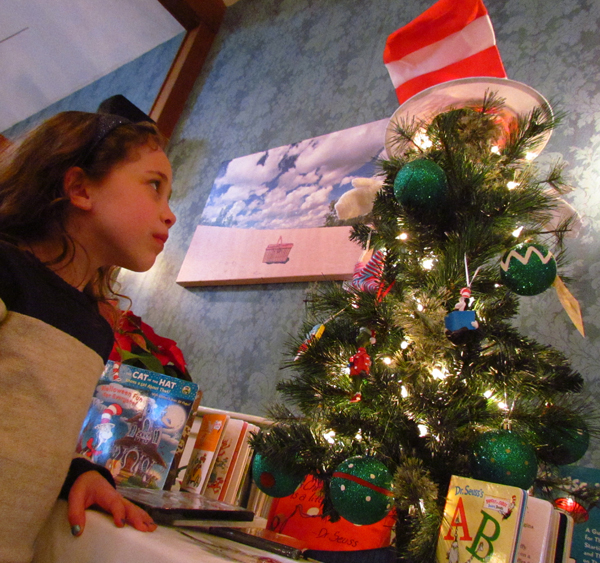 Brooke Ashley inspects the Cat in the Hat tree, books and fun from the HUB Child and Family Centre.