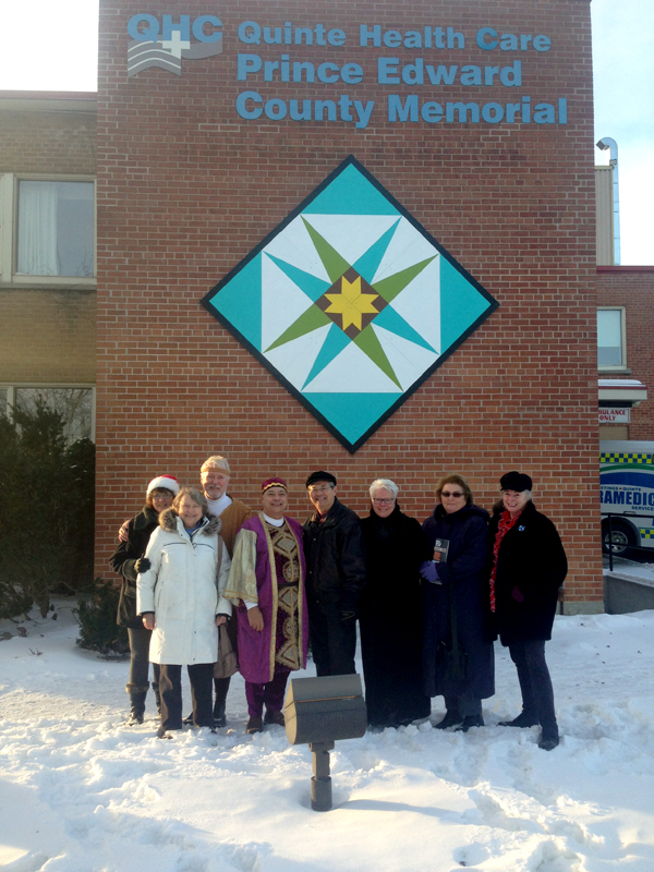 Marysburgh Mummers pose for a photo after the unveiling of the barn quilt, Thursday. Briar Boyce photos