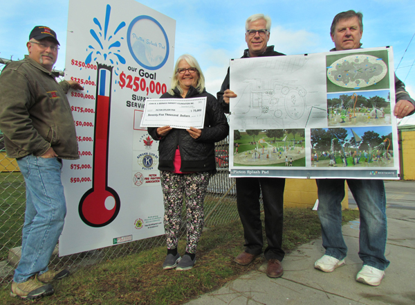Picton Splash Pad committee members Phil St. Jean, Susan Quaiff, Scott Wentworth and Kevin Gale at the project fundraising thermometer at the Picton Fairgrounds having just painted in the updated funds raised to $206,000, thanks to a $75,000 donation from the Parrott Foundation.
