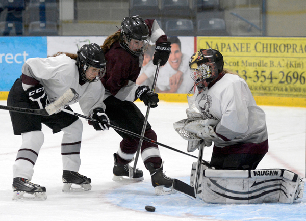 Abby Terpstra battles for the puck in front of the net in the game versus Frontenac.