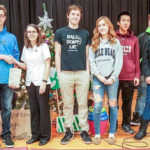 PECI students present $1,000 to support children in need
