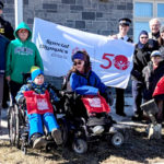Flag raising celebrates 50th anniversary of Special Olympics