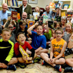 Church pays $10,000 gift forward to buy children new books
