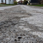 Single surface road treatment begins